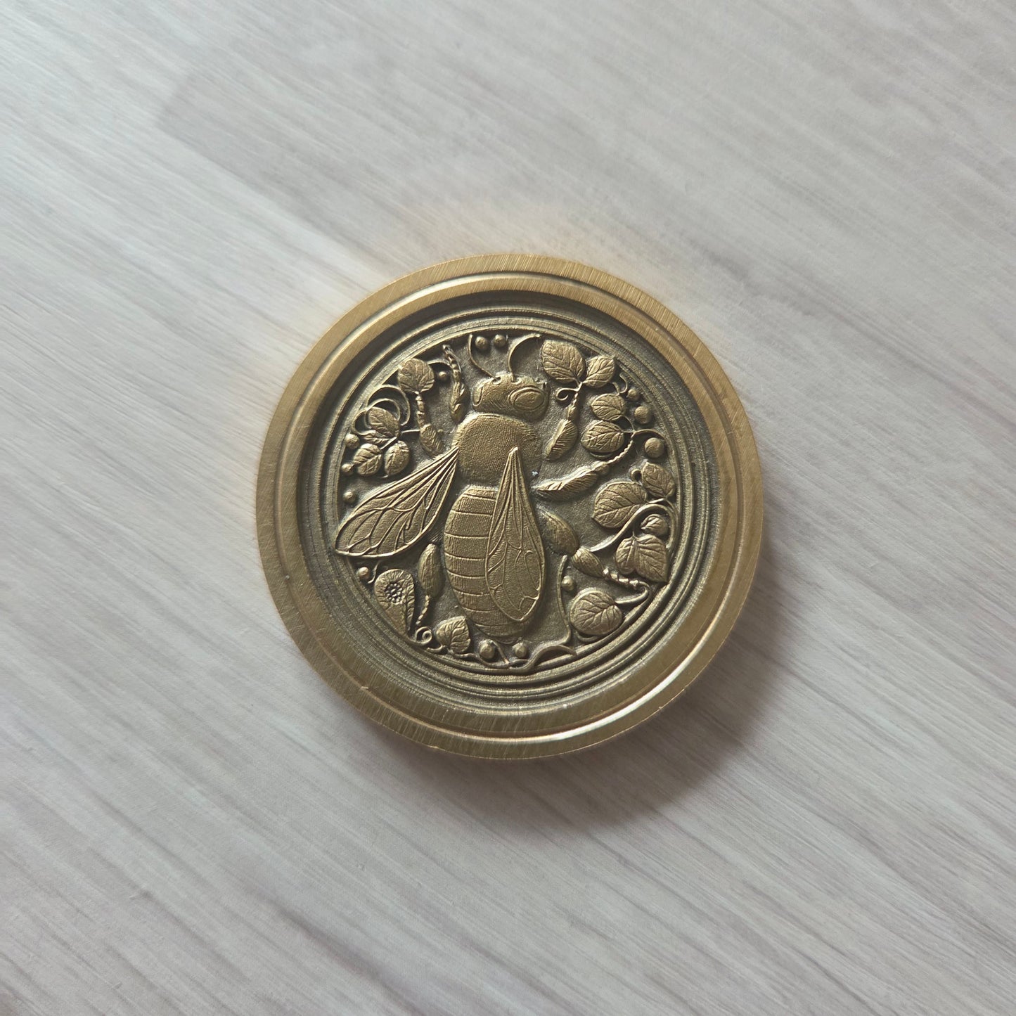3 Brass Coins Carved with a Bee on a Flower
