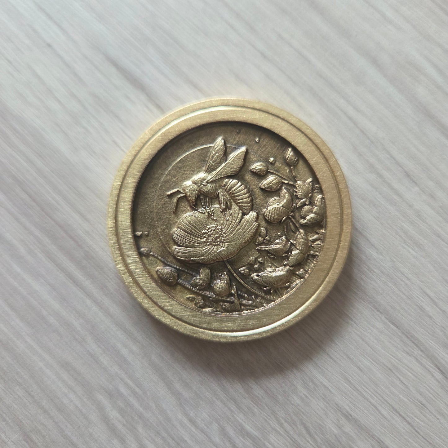 3 Brass Coins Carved with a Bee on a Flower