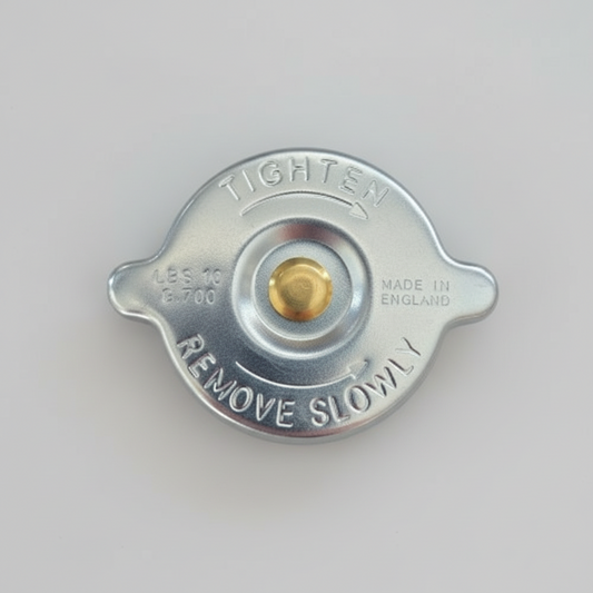 Metal radiator cap with 'Tighten' and 'Remove Slowly' text on a white background