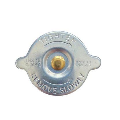 Metal radiator cap with 'Tighten' and 'Remove Slowly' text on a white background