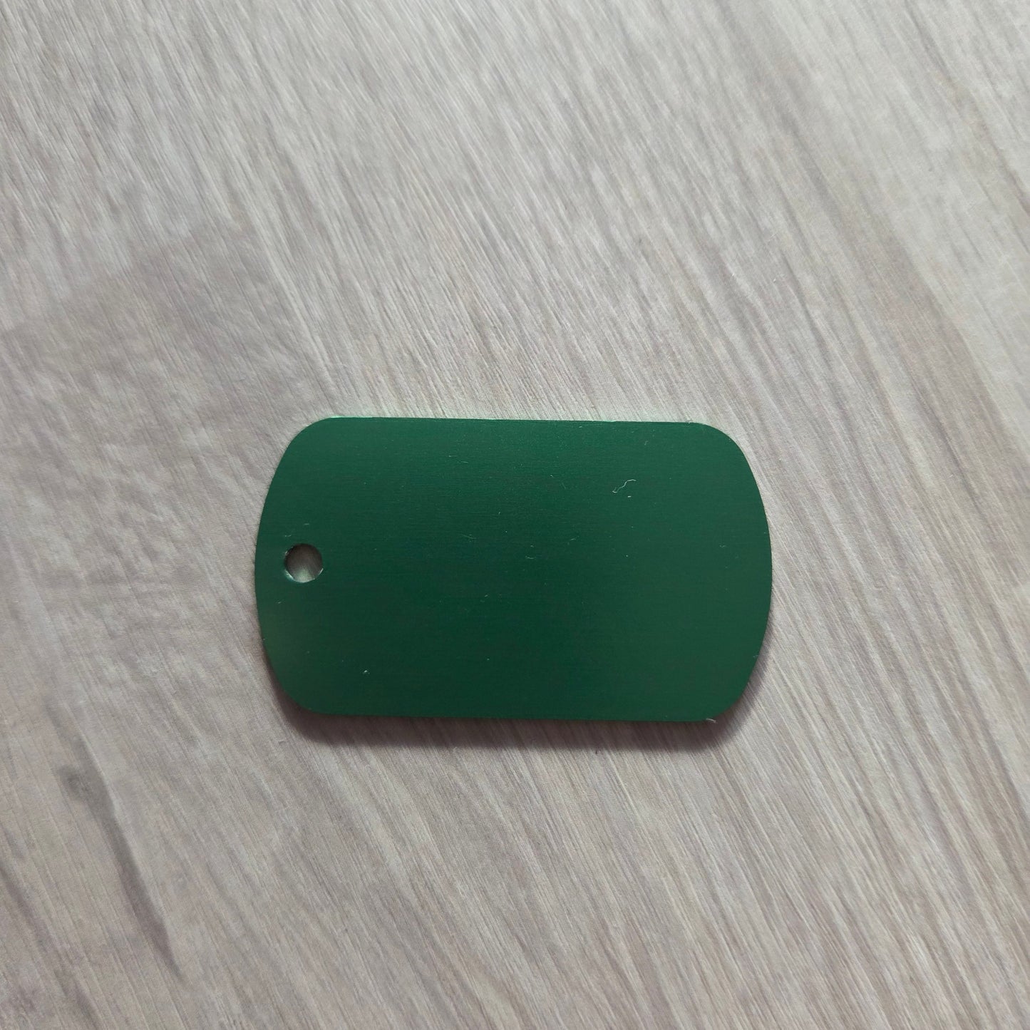 Green Keyring  on a gray surface