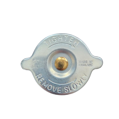 Metal radiator cap with text 'Tighten' and 'Remove Slowly' on a white background